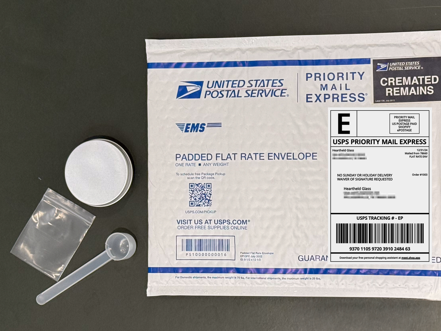 The prepaid shipping kit that is sent out for you to mail your ashes to Heartheld Glass, includes a scoop, bag, tin and prepaid Priority Mail Express mailer.